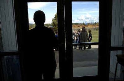 
Students line up after recess at Naples Elementary School on Wednesday. The school is in danger of being closed because of a failed levy election. 
 (Kathy Plonka / The Spokesman-Review)