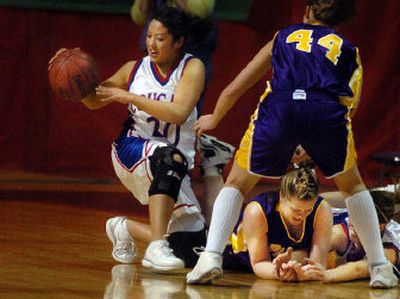 
Curlew's Larissa Miller, left, snatches the ball from a pile of players in a first-round game against Pateros. 
 (Kathryn Stevens / The Spokesman-Review)