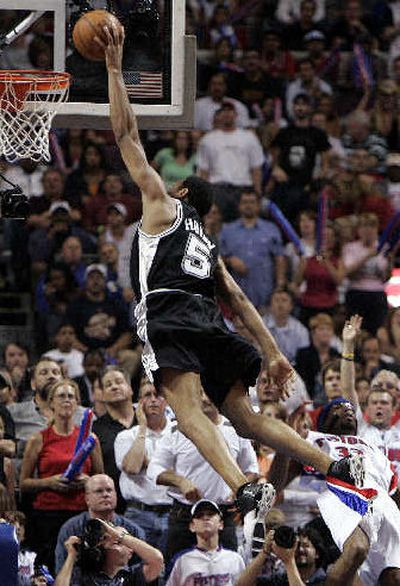 
San Antonio's Robert Horry scores over Detroit's Richard Hamilton, right, during overtime in Game 5 of the NBA Finals in Auburn Hills, Mich., on Sunday. 
 (Associated Press / The Spokesman-Review)