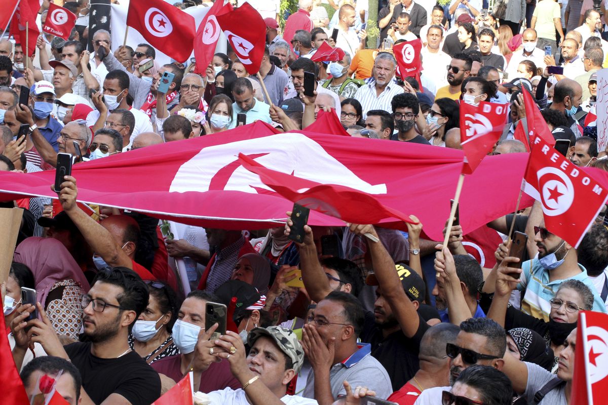 Tunisians demonstrate in support of Tunisian President Kais Saied in Tunis, Tunisia, Sunday, Oct. 3, 2021. President Saied froze the country