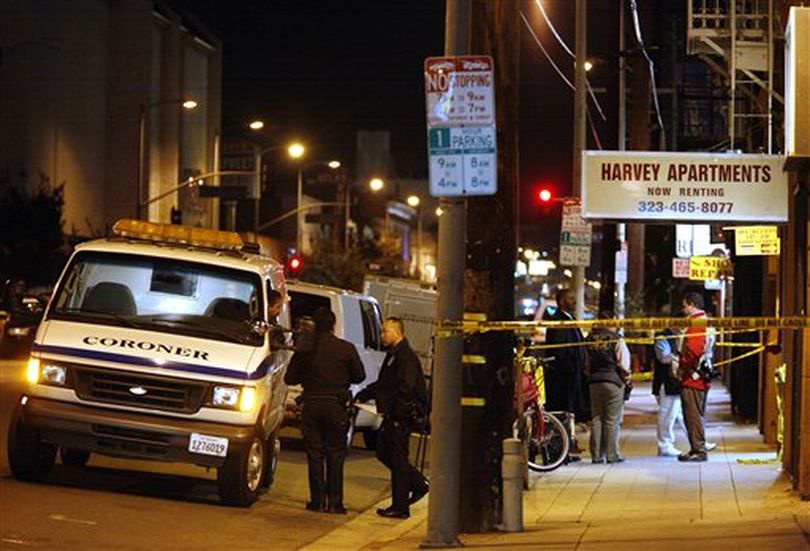 A coroner's vehicle waits outside a residential hotel where a suspect in the killing of publicist Ronni Chasen fatally shot himself as Beverly Hills Police were serving a search warrant on Wednesday, Dec. 1, 2010, in Los Angeles. Chasen  was shot to death in Beverly Hills, Calif. as she drove home on Nov. 16, 2010.  (Jason Redmond / (AP Photo/Jason Redmond))