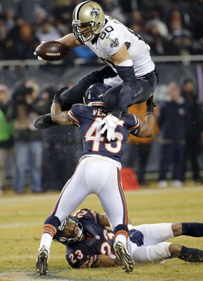 Saints tight end Jimmy Graham leaps over Bears safety Brock Vereen. (Associated Press)