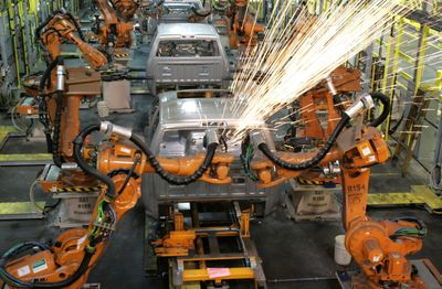 Assembly line robots weld the front cab of a 2009 Dodge Ram pickup being assembled at the Warren Truck Plant in Warren, Mich., in September.  (File Associated Press / The Spokesman-Review)