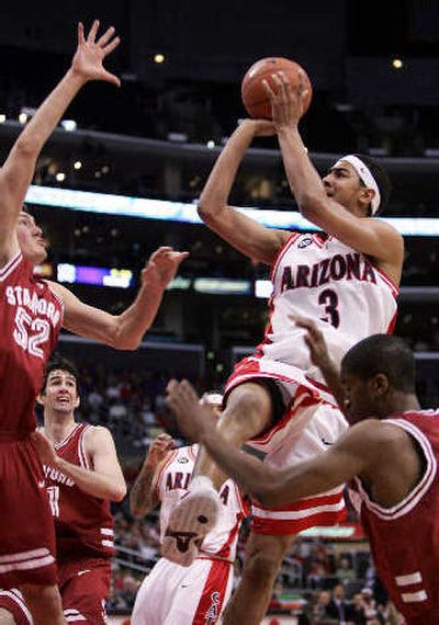 
Arizona's Marcus Williams shoots over Stanford's defense. 
 (Associated Press / The Spokesman-Review)