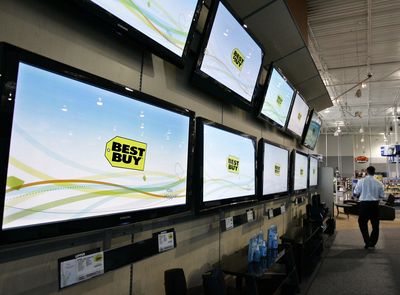 Flat-panel televisions are seen on display at a Best Buy store in Mountain View, Calif. Best Buy Co. on Wednesday sharply cut its fiscal 2009 earnings outlook below analyst estimates amid what the electronics retailer called the toughest retail environment it has ever seen.  Associated Press file (Associated Press file / The Spokesman-Review)