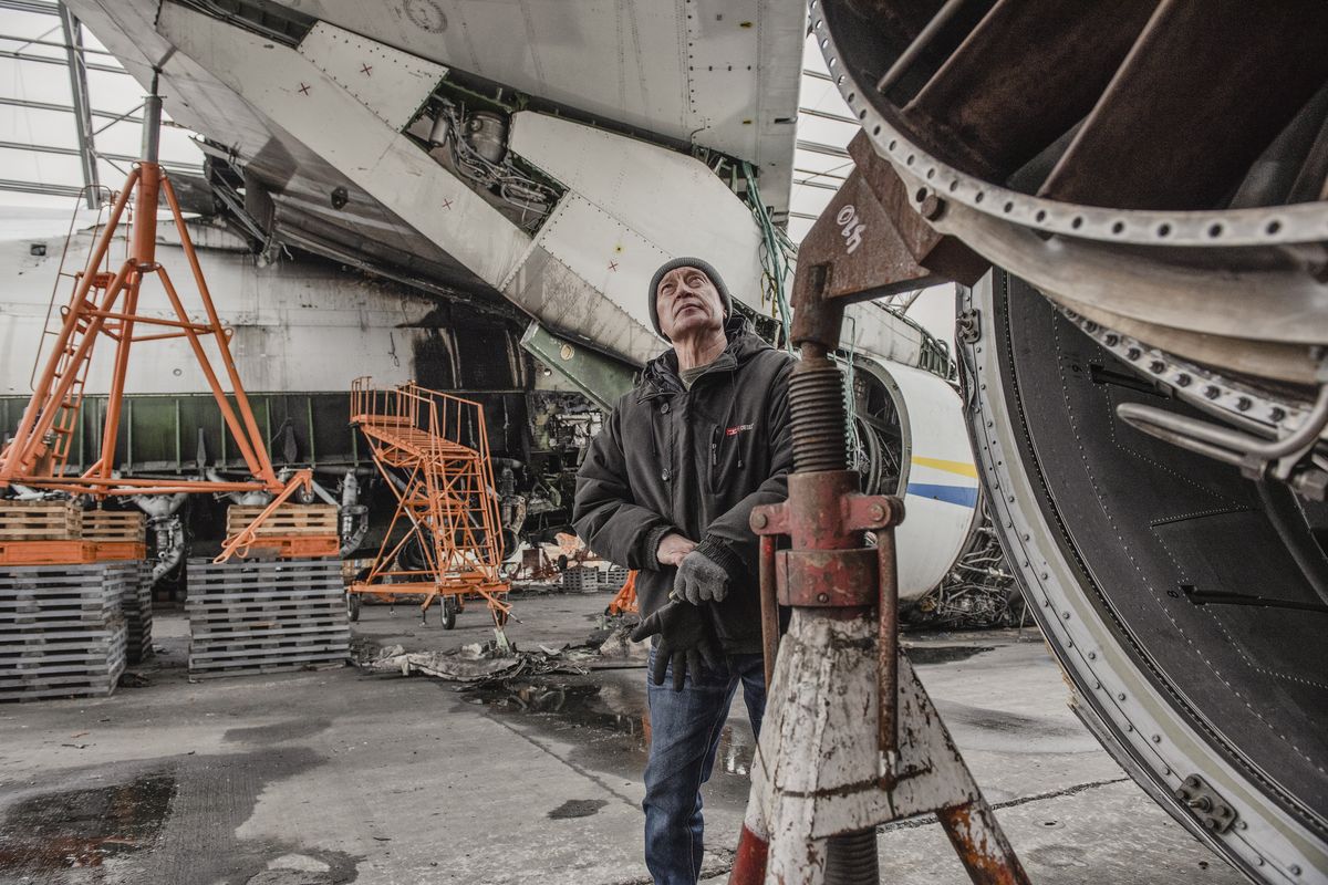 Valentyn Kostiyanov, a technician who has worked at Antonov for more than 50 years and helped build the Mriya, at an airfield outside Kyiv, Ukraine on March 9, 2023. Kostiyanov now works on the salvage operation.   (Laetitia Vancon/The New York Times)