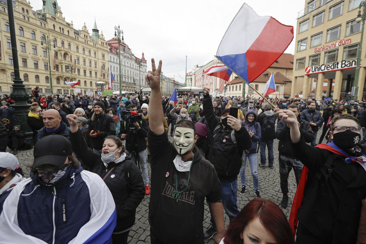 Demonstrators gather to protest the COVID-19 preventative measures downtown Prague, Czech Republic, Wednesday, Oct. 28, 2020. Coronavirus infections in the Czech Republic have again jumped to record levels amid new restrictive measures imposed by the government to curb the spread.  (Petr David Josek)