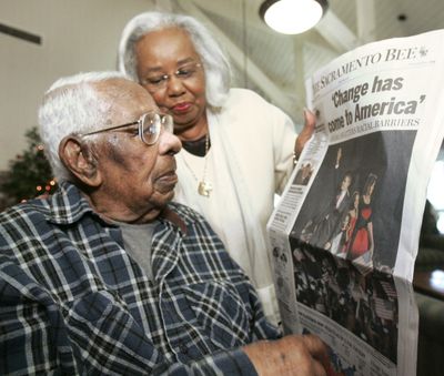 George Francis is shown  a copy of the Nov. 5 newspaper with President-elect Barack Obama on the front page.  (File Associated Press / The Spokesman-Review)