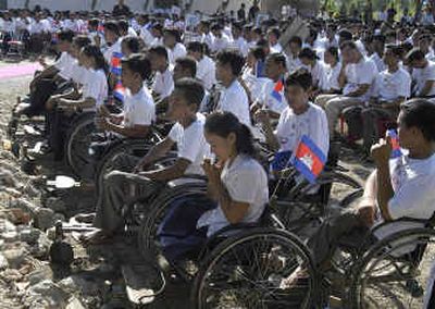 
Cambodian land mine victims listen on Monday to King Norodom Sihamoni in Trapeang Veng, west of Phnom Penh, Cambodia. Worldwide, more than 8,000 people were killed or maimed last year by land mines. 
 (Associated Press / The Spokesman-Review)