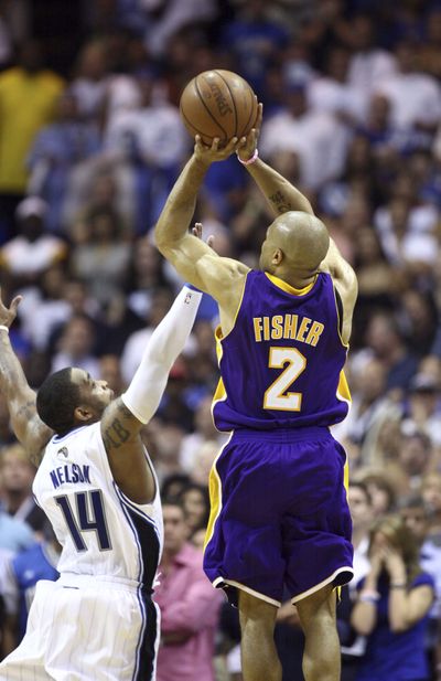 Derek Fisher’s shot late in regulation got his team into OT, then he hit the go-ahead basket to win.  (Associated Press / The Spokesman-Review)