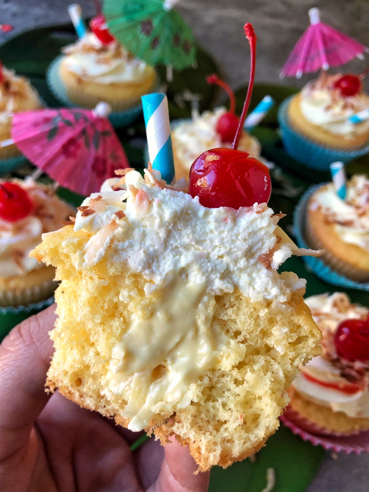 These piña colada cupcakes are topped off with a light and airy frosting.  (Audrey Alfaro/For The Spokesman-Review)