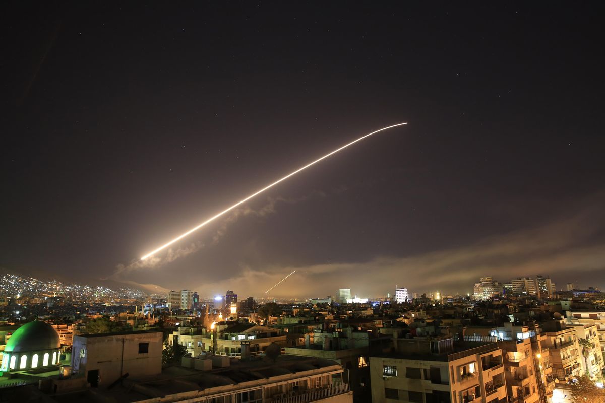 Damascus sky lights up with surface-to-air missile fire as the U.S. launches an attack on Syria targeting different parts of the Syrian capital Damascus, Syria, early Saturday, April 14, 2018. Syria’s capital has been rocked by loud explosions that lit up the sky with heavy smoke as U.S. President Donald Trump announced airstrikes in retaliation for the country’s alleged use of chemical weapons. (Hassan Ammar / Associated Press)