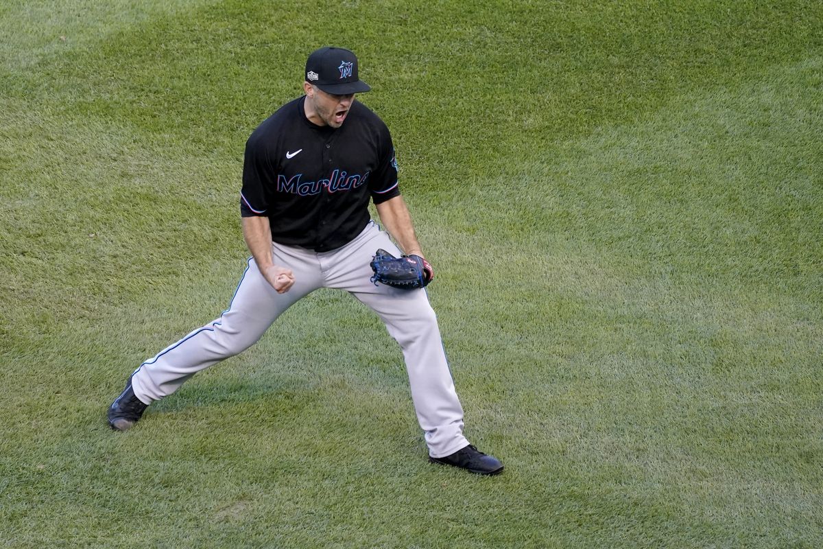 Miami Marlins relief pitcher Brandon Kintzler celebrates a 2-0 victory over the Chicago Cubs in Game 2 of a National League wild-card baseball series Friday, Oct. 2, 2020, in Chicago. The Marlins won the series 2-0 to advance to the division series. (Nam Y. Huh)