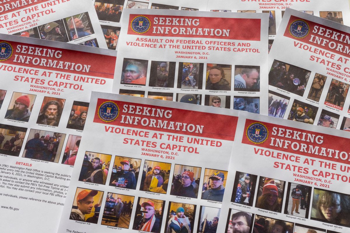 Seeking information flyers produced by the FBI are photographed on Dec. 20, 2021. The Justice Department has undertaken the largest investigation in its history with the probe into rioters who stormed the Capitol on Jan. 6. (AP Photo/Jon Elswick  (Jon Elswick)