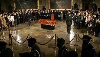 
The honor guard walks past after carrying the casket of civil rights pioneer Rosa Parks into the U.S. Capitol Rotunda  on Sunday. 
 (Associated Press / The Spokesman-Review)
