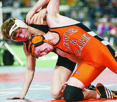 
Lewis and Clark's Trevor Powell battles his way to a 2-1 win over University's Brian Owen in the State 4A 125-pound title match at Mat Classic. 
 (Patrick Hagerty Special to / The Spokesman-Review)