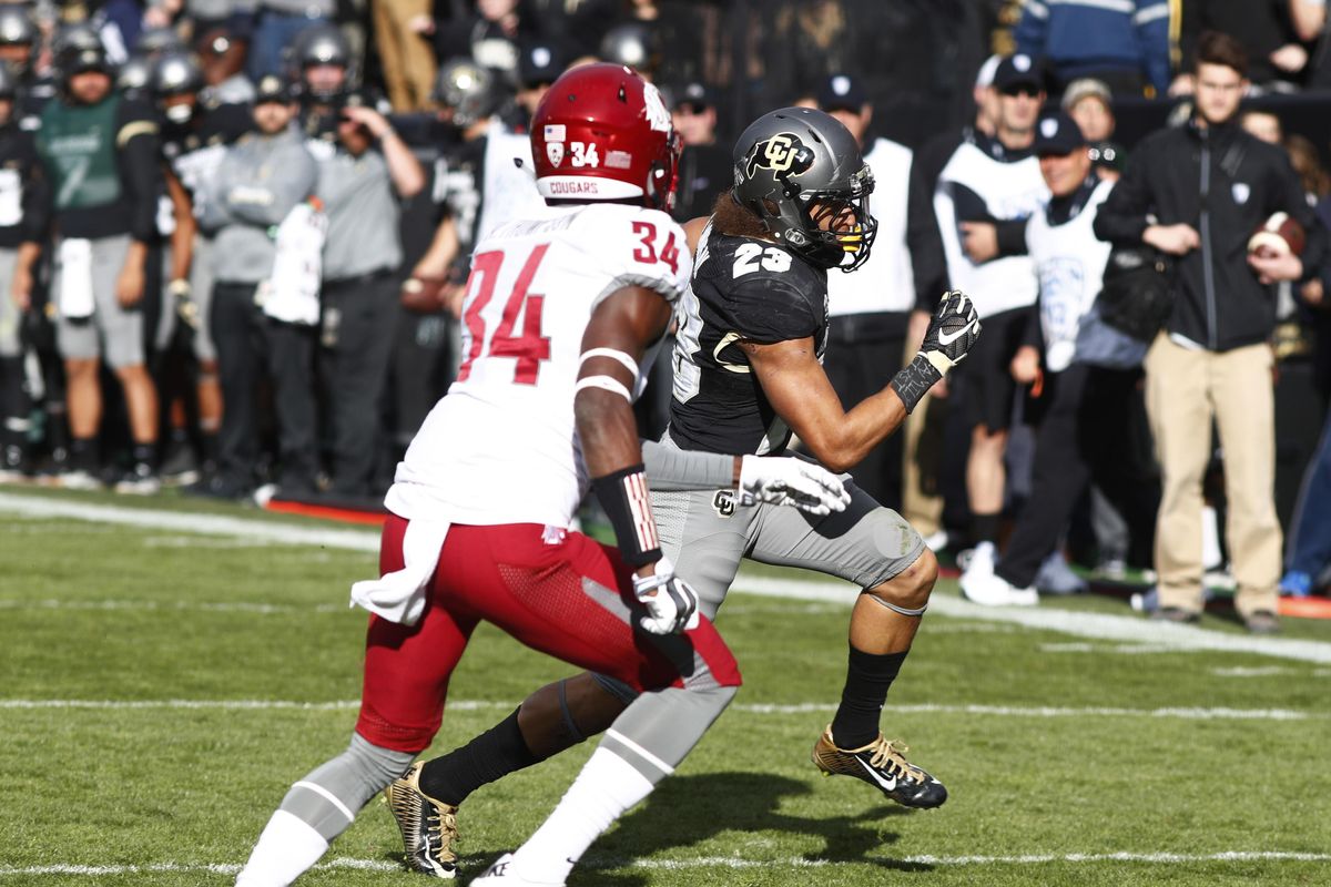 In this Nov. 19, 2016 file photo, Washington State safety Jalen Thompson, front, pursues Colorado running back Phillip Lindsay as he heads in for a touchdown in the first half of an NCAA college football game in Boulder, Colo. (David Zalubowski / Associated Press)