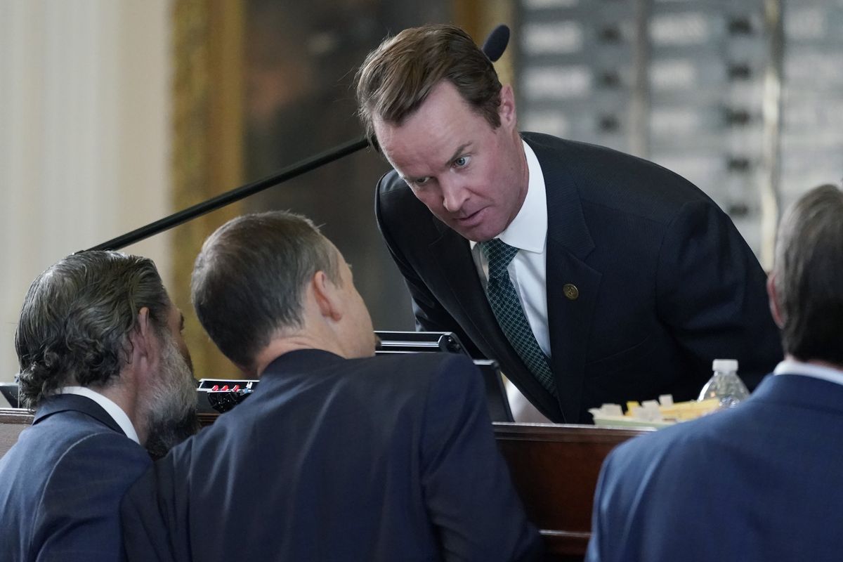 Speaker of the House Dade Phelan, R-Orange, top center, talks with Rep. Andrew Murr, R-Kerrville, center, as the House debates election bill SB1, Thursday, Aug. 26, 2021, in Austin, Texas.  (Eric Gay)