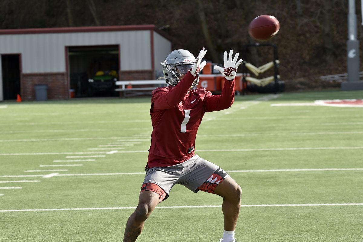 Washington State wide receiver Travell Harris catches a pass Thursday during the Cougars’ first spring practice in Pullman.  (Courtesy of WSU Athletics)