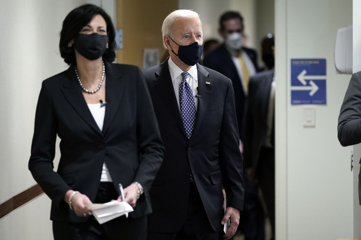 Dr. Rochelle Walensky, director of the Centers for Disease Control and Prevention, walks with President Joe Biden for a COVID-19 briefing March 19 in Atlanta.  (Patrick Semansky)