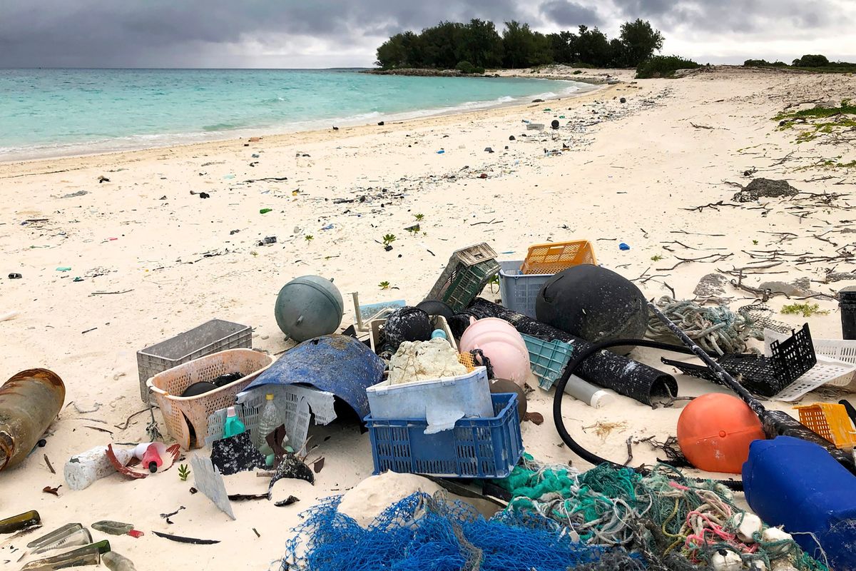 Photo, plastic and other debris is seen on the beach on Midway Atoll on Oct. 22, 2019, in the Northwestern Hawaiian Islands.  (Caleb Jones)