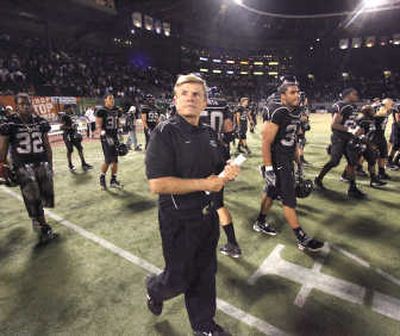 
Black-clad Jerry Glanville and his black-clad Portland State Vikings leave the field after a Sept. 8 loss to UC Davis. Associated Press
 (Associated Press / The Spokesman-Review)