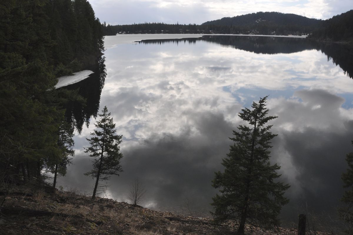 Bead Lake was alternating from stunning to moody, still partially covered with ice, as the Inland Northwest Hikers Meetup group trekked  Colville National Forest Trail 127 northeast of Newport, Wash., on April 3, 2011. 
 (Rich Landers)