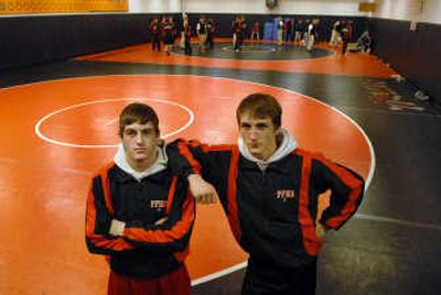 
Cousins Danny Booth, left and Ryan Booth, senior wrestlers for Post Falls High School on Monday. Both wrestlers have gone over the 100-victory milestone this season
 (Kathy Plonka / The Spokesman-Review)