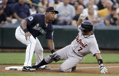 
Ivan Rodriguez of the Tigers slides into a tag by Mariners third baseman Adrian Beltre while trying for a triple in the fourth inning.  Associated Press
 (Associated Press / The Spokesman-Review)