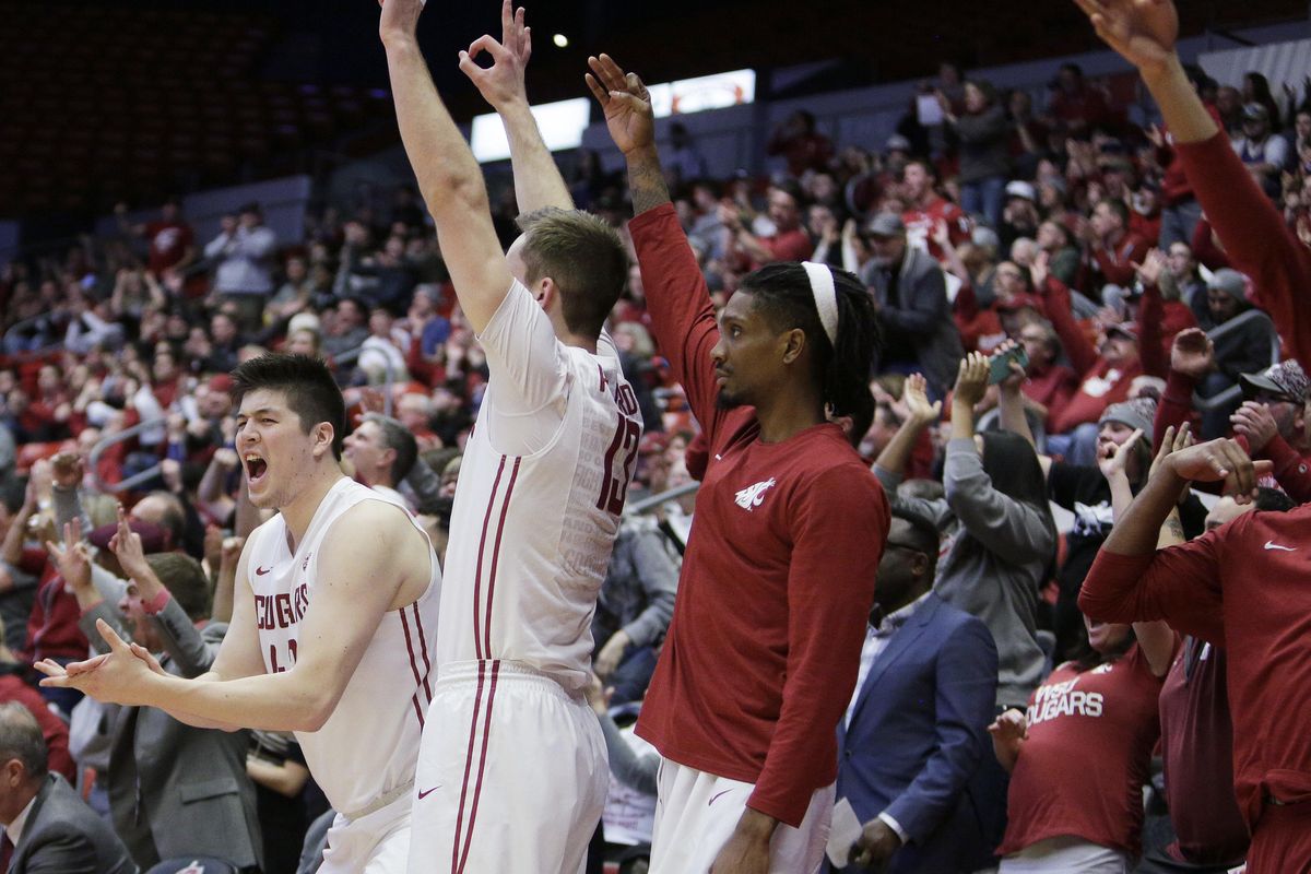 The Washington State bench celebrates during the second half of an NCAA college basketball game against Washington in Pullman, Wash., Sunday, Feb. 26, 2017. Washington State won 79-71. (Young Kwak / Associated Press)