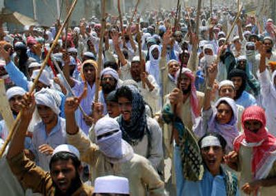 
Students protest the army's raid against Islamic militants holding Islamabad's  Red Mosque on Tuesday in Multan, Pakistan.  Fighting during the raid  killed about 50 militants and eight soldiers. Associated Press photos
 (Associated Press photos / The Spokesman-Review)