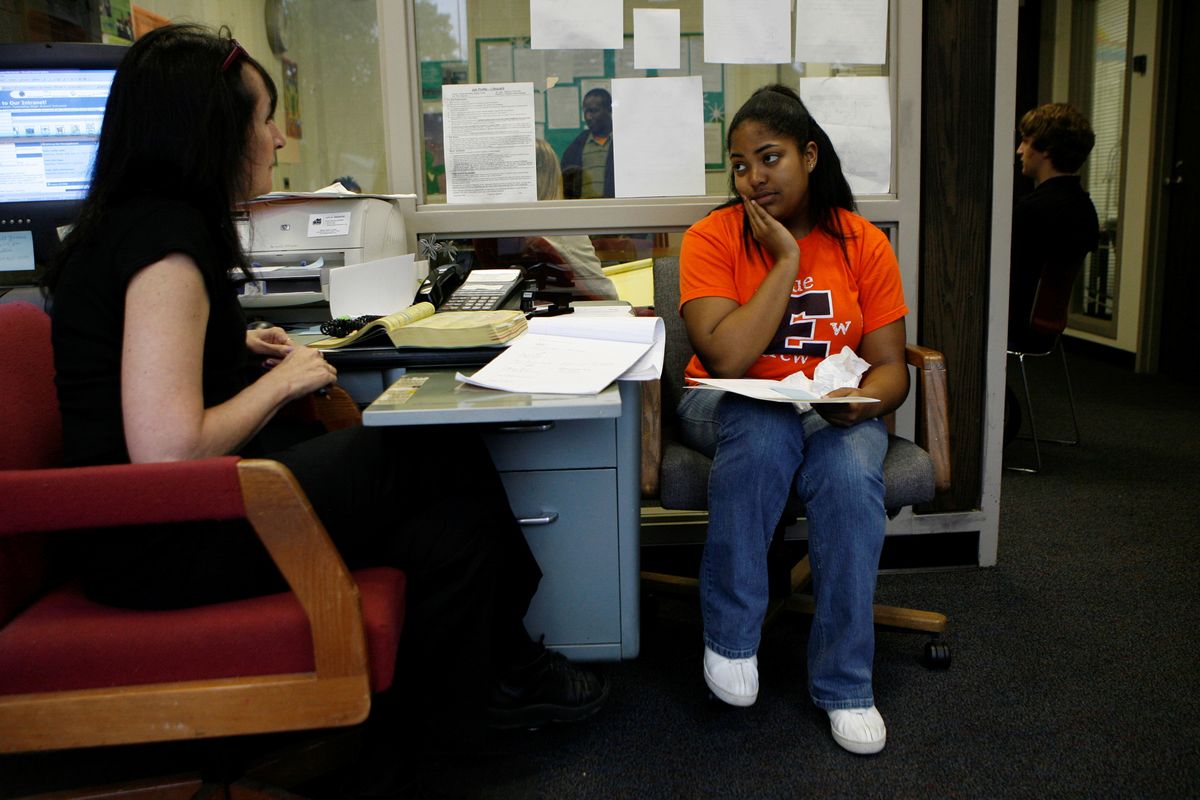 Youth Job Center counselor Pamela Kaul, left, assists Ariel Ausmer, 17, a junior, with job leads at the Youth Job Center at Evanston Township High School in Evanston, Ill. McClatchy Tribune file photo (McClatchy Tribune file photo)