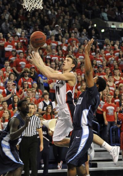Gonzaga’s David Stockton, center, flies past San Diego’s defenders but doesn’t get the basket. (Jesse Tinsley)