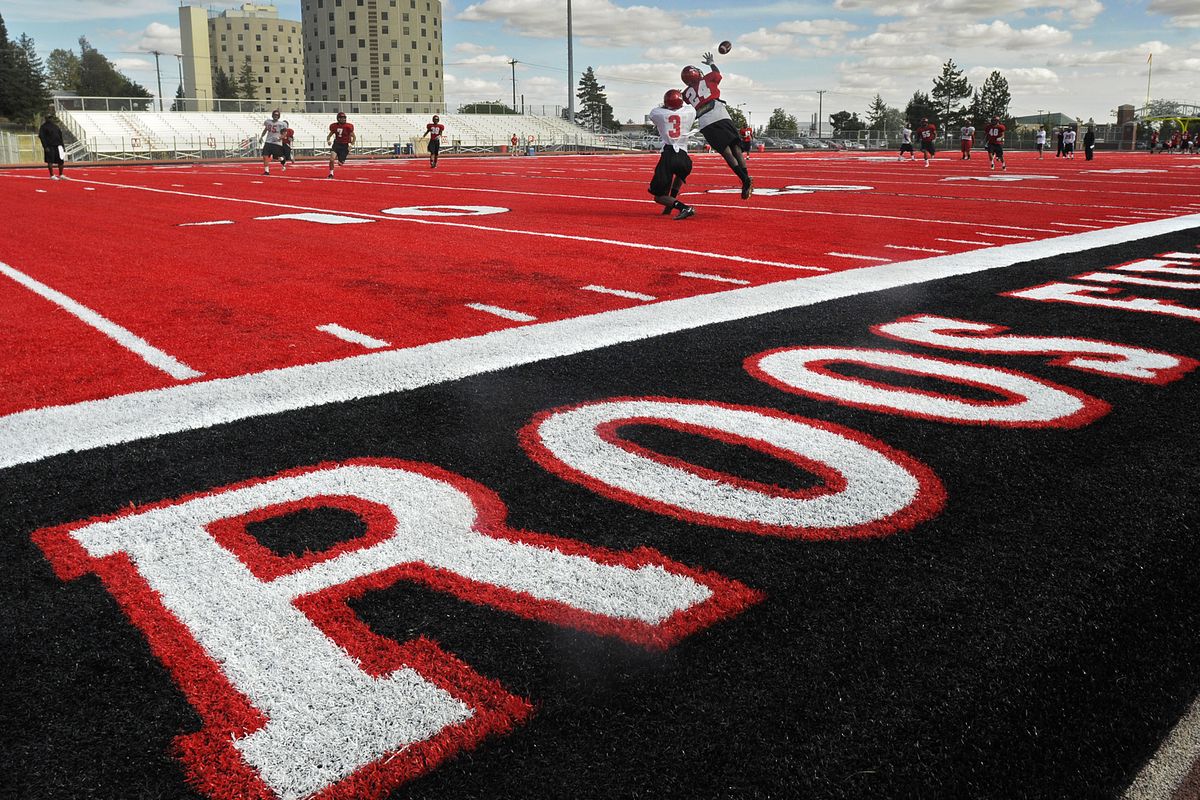 Eastern Washington football players practice for the first time on the new red turf at soon-to-be-named Roos Field. (Christopher Anderson)