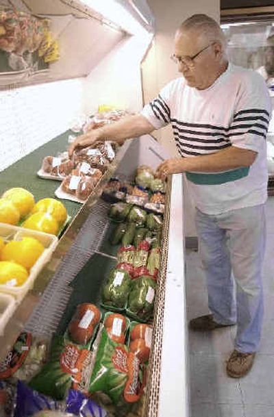 William Laste looks through what little fresh produce is stocked at his store in Pittsburg, N.H., last month. The selection is limited, and the price is almost double what he pays when he drives to the southern part of the state to shop.
(Associated Press / The Spokesman-Review)