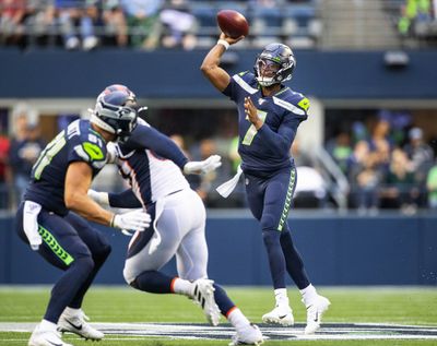 Seattle Seahawks quarterback Geno Smith (7) gets enough protection to throw a first-quarter pass against the Denver Broncos during a preseason game at Century Link Field in Seattle on Thursday, Aug. 8, 2019.  (Dean Rutz/Seattle Times)