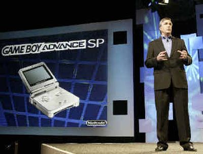 George Harrison, Nintendo senior vice president of marketing and corporate communications, speaks during an announcement of new Nintendo handheld gaming devices Tuesday in Los Angeles. Nintendo announced two new products the