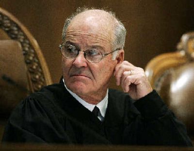 
Gerry Alexander, chief justice of the Washington State Supreme Court, listens to arguments in the West case on Wednesday in Olympia. 
 (Associated Press / The Spokesman-Review)