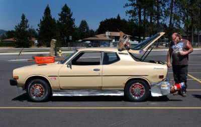 
Vern Cox opens the hatchback of his 1978 Datsun F10, a work in progress.
 (Liz Kishimoto / The Spokesman-Review)