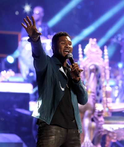 Usher’s seventh album, “Looking 4 Myself,” fuses global, electronic dance music and pop music. (Associated Press)