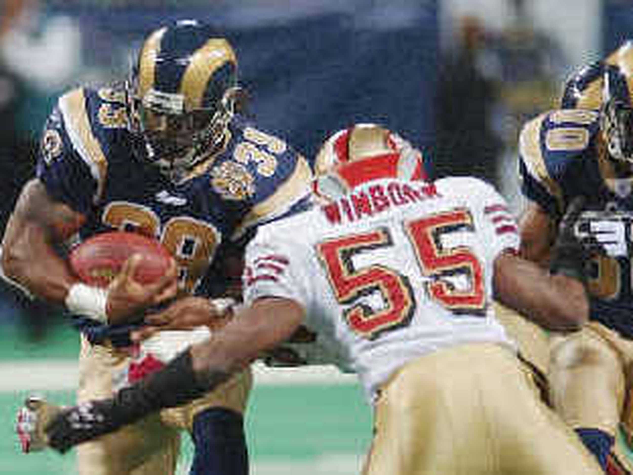 San Francisco 49ers' Bryant Young celebrates a sack against the Rams' QB  Marc Bulger at Monster Stadium in San Francisco on September 11, 2005. (UPI  Photo/Terry Schmitt Stock Photo - Alamy