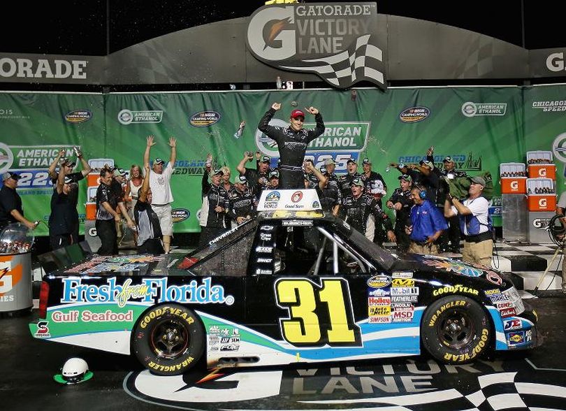 James Buescher, driver of the #31 Fresh from Florida Gulf Seafood Chevrolet, celebrates winning the NASCAR Camping World Series American Ethanol 225 at Chicagoland Speedway on July 21, 2012, in Joliet, Ill. (Photo Credit: Jonathan Daniel/Getty Images) (Jonathan Daniel / Getty Images North America)