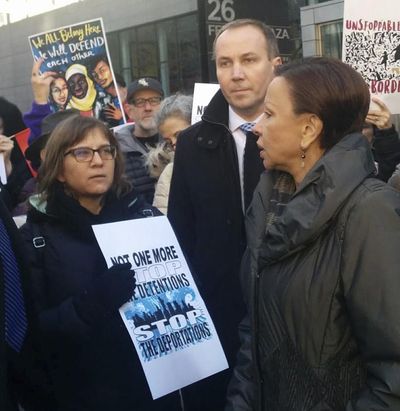 U.S. Rep. Nydia Velazquez addresses Amy Gottlieb, left, the wife of detained immigrant rights activist Ravi Ragbir during a demonstration Saturday, Jan. 27, 2018, in front of the Manhattan office building that houses Immigration and Customs Enforcement New York. Velazquez has invited Gottlieb to President Donald Trump's State of the Union address on Tuesday, Jan. 30. (Julie Walker / AP)