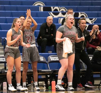 North Idaho College’s bench celebrates a 3-pointer against Community Colleges of Spokane in a rivalry game at Spokane Community College on Feb. 19, 2020. The Cardinals defeated the CCS Sasquatch 69-46.  (Libby Kamrowski/THE SPOKESMAN-REVIEW)