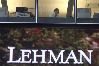A man looks out the window at the Lehman Brothers headquarters in New York. (The Spokesman-Review)