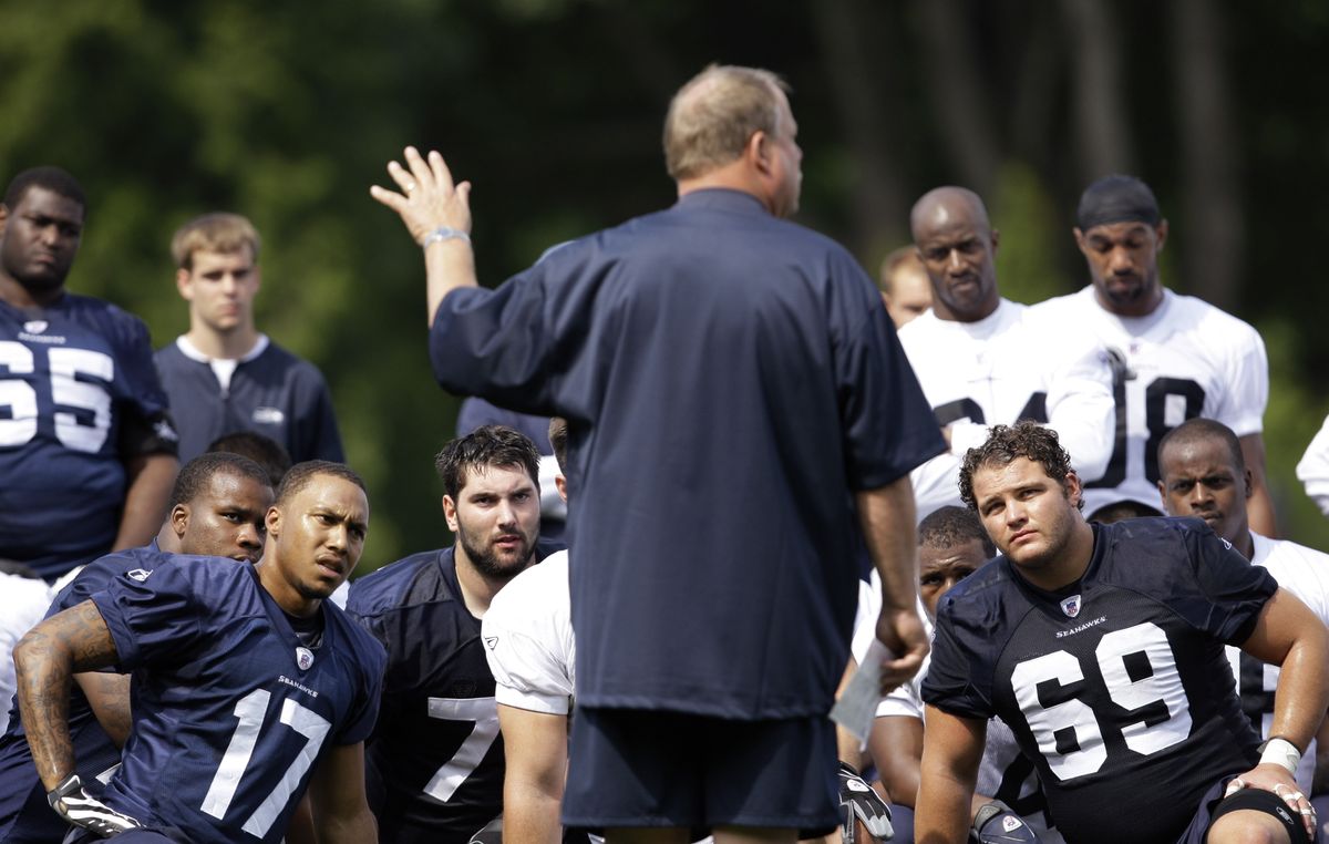 Seattle Seahawks coach Mike Holmgren addressed his team following the morning workout. Holmgren will retire at the end of the season. (Associated Press / The Spokesman-Review)
