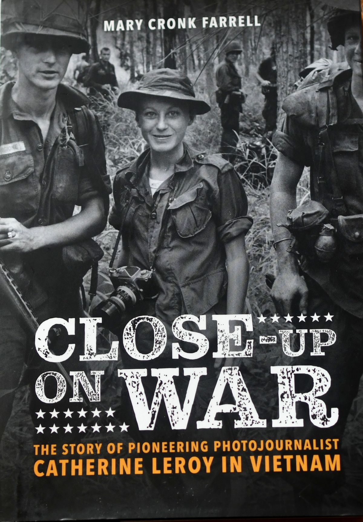 Author Mary Cronk Farrell’s book “Close-Up on War: The Story of Pioneering Photojournalist Catherine Leroy in Vietnam,” is photographed in her home in Spokane on March 15.  (Kathy Plonka/The Spokesman-Review)
