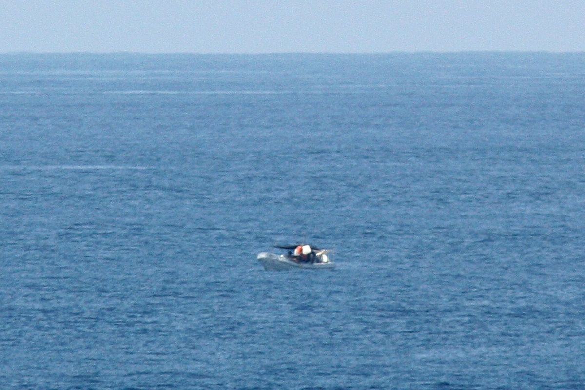 This March 10 photo provided by Jeff Gilligan, a passenger on the cruise ship Star Princess, shows a fishing vessel adrift in the Pacific Ocean off the Galapagos Islands. Gilligan and another passenger alerted the crew, but the liner continued on its course. (Associated Press)