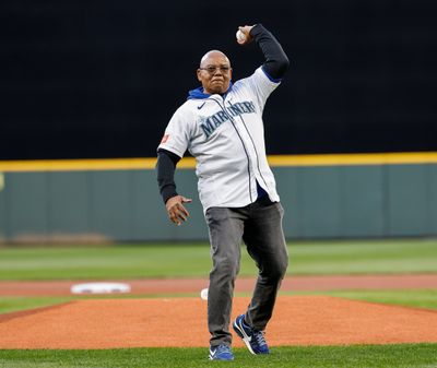 Ruppert Jones throws out the ceremonial first pitch for the Seattle Mariners' March 26 season opener against the Cleveland Guardians at T-Mobile Park.  (Dean Rutz/Seattle Times)