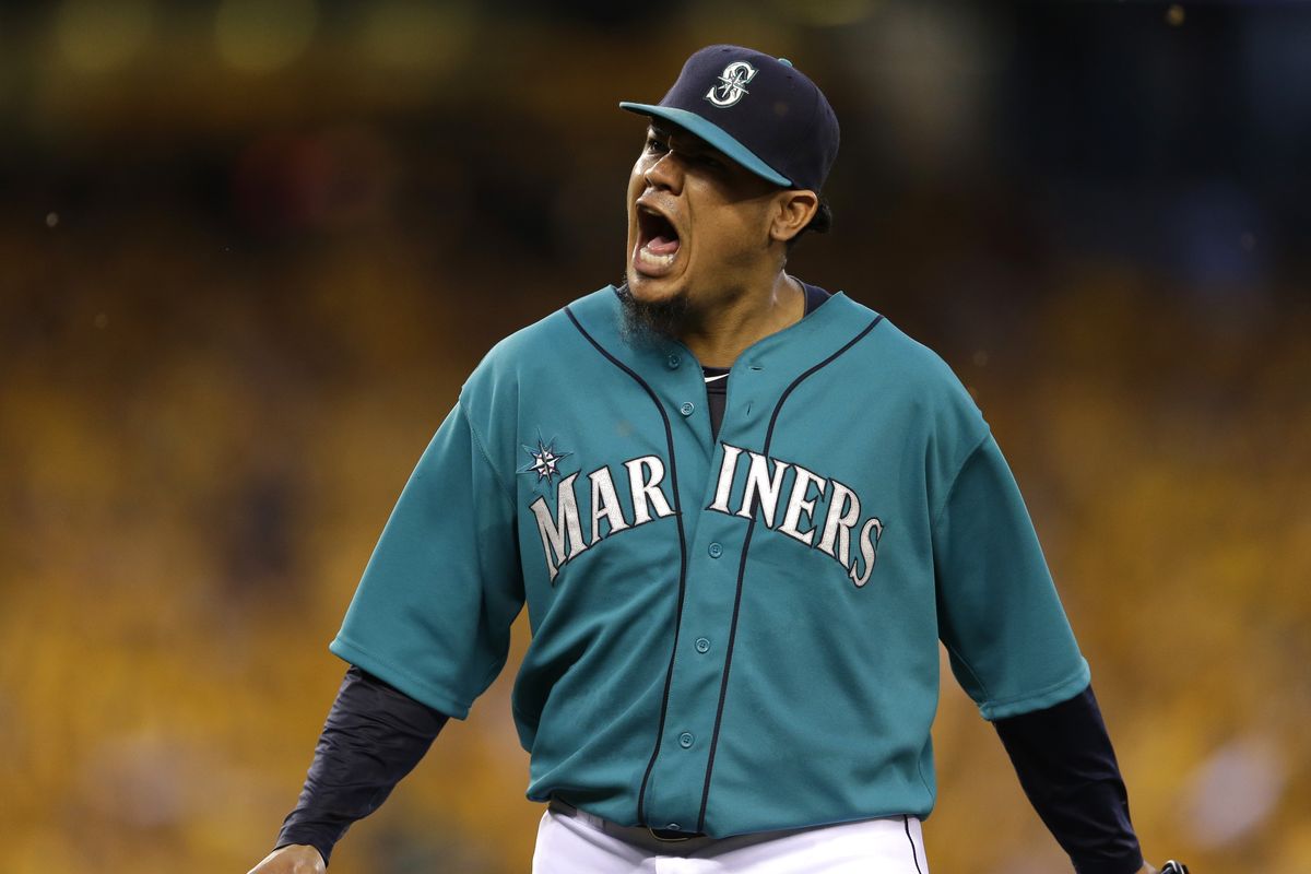 Mariners ace Felix Hernandez yells after Seattle turned a double play in the eighth inning. Hernandez hopes to start the All-Star Game. (Associated Press)